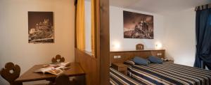 Postel nebo postele na pokoji v ubytování Hotel Residence Chateau