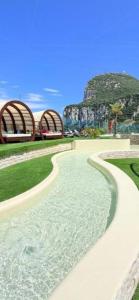 a walkway next to a body of water at Gibraltar Luxe Stay 1403 in Gibraltar