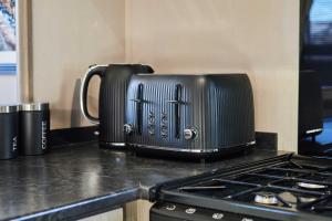 a toaster sitting on top of a kitchen counter at Host & Stay - 10th Avenue in Morpeth