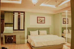 a bedroom with a bed in a room at Piyush stay in Lucknow
