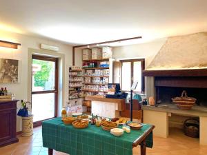 a living room with a table with food on it at Agriturismo Girolomoni - Monastero in Isola del Piano