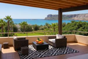 a patio with a view of the ocean at Palazzo Navarone in Lindos
