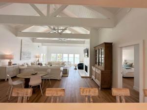 a living room with a couch and a table at Blue Heron Hideaway in Rockport