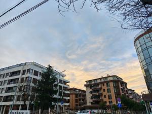 a city with tall buildings and a cloudy sky at Chance Sarafovo in Burgas