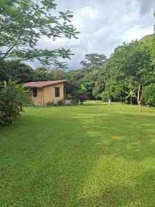 a house in the middle of a green yard at Casa Solomaco in Vilcabamba