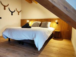a bedroom with a large bed with wood paneling at La Source in Saint-Gervais-les-Bains