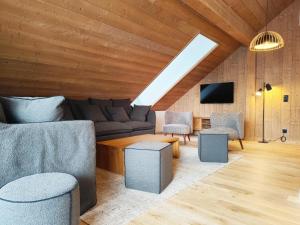 a living room with a couch and a table and chairs at La Source in Saint-Gervais-les-Bains