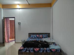 a bedroom with a bed in a room at Jinkos Homestay with self cooking facility in Itānagar