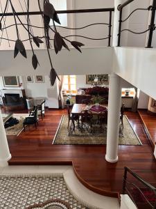 a dining room and living room with a table at Αρχοντικό Λίθος in Kastoria