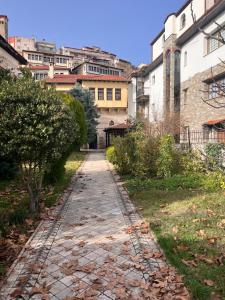 an empty street in a city with buildings at Αρχοντικό Λίθος in Kastoria