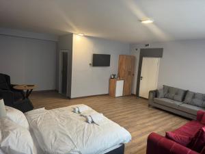 a living room with a bed and a couch at ATAKORU Suit in Alacaatlı +20 photos