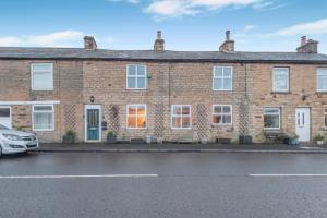 a brick house with a car parked in front of it at 3 Bed in Nenthead oc-c34668 in Nenthead