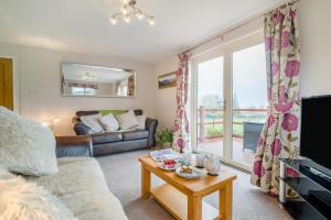 a living room with a couch and a window at 2 Bed in Coaley oc-s34729 in Coaley