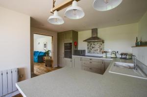 a kitchen with white cabinets and a counter top at 2 Bed in Newton oc-ffba in Newton +4 photos