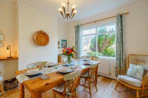 a dining room with a table and chairs and a window at 3 Bed in Gosforth oc-s34885 in Gosforth