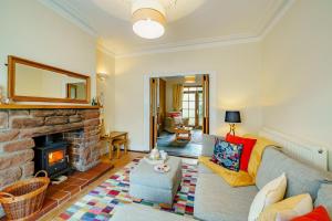 a living room with a couch and a fireplace at 3 Bed in Gosforth oc-s34885 in Gosforth