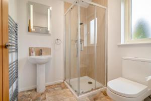 a bathroom with a shower and a toilet and a sink at 2 Bed in Coaley oc-r34730 in Coaley +15 photos