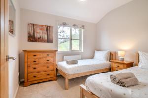 a bedroom with two twin beds and a window at 2 Bed in Coaley oc-r34730 in Coaley