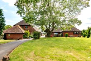a house with a tree in front of a yard at 2 Bed in Alkham oc-p34785 in Swingfield