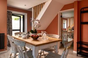 a dining room with a wooden table and chairs at 2 Bed in Alkham oc-a34787 in Swingfield