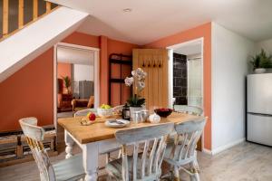 a dining room with a wooden table and chairs at 2 Bed in Alkham oc-a34787 in Swingfield +13 photos