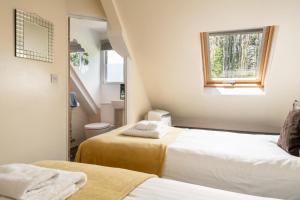 a small room with two beds and a window at 2 Bed in Alkham oc-a34787 in Swingfield