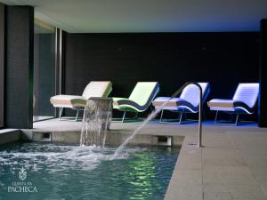 a fountain in a room with chairs in a building at Pacheca The Wine House Hotel e Spa - Quinta da Pacheca in Lamego +82 photos