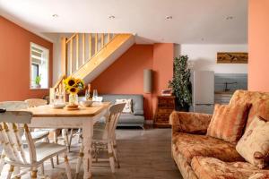 a living room with a table and a couch at 2 Bed in Alkham oc-v34789 in Swingfield
