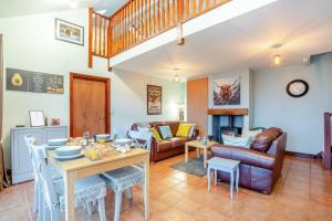 a living room with a table and a couch at 2 Bed in Escomb oc-o34978 in Acomb