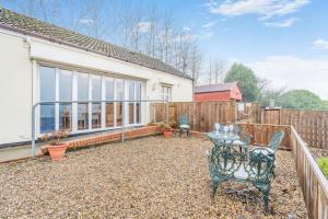 a patio with a table and chairs and a fence at 2 Bed in Escomb oc-o34978 in Acomb