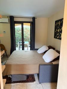 a large bed in a room with a window at I Bugni in Sisco +14 photos
