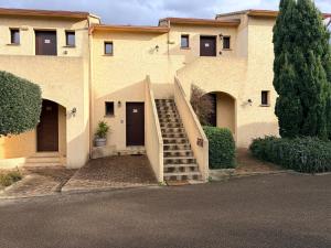a building with a staircase in front of it at I Bugni in Sisco