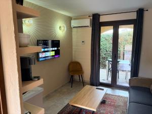 a living room with a couch and a table at I Bugni in Sisco