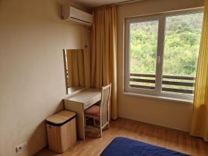 a room with a desk and a window at Harmony Hills Family Apartments in Rogachevo +72 photos