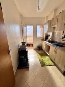 a kitchen with a sink and a counter top at Apartmen rentals with M Z in Marrakesh +14 photos