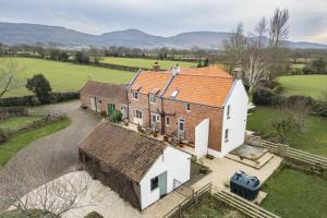 an aerial view of a house with a yard at Green Balk Cottage in Stokesley