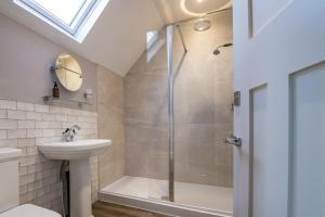 a bathroom with a shower and a sink at Green Balk Cottage in Stokesley +27 photos