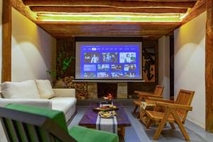 a living room with a fireplace and a tv at 心墅 空间 in Dali