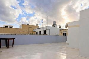 a view from the roof of a building at Modern House with Pool - 10 Guests Max in Taʼ Ċantar