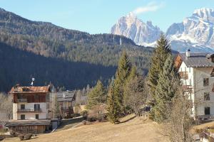 a view of a town with a mountain in the background at Casa Tomà Mountain View Cortina in San Vito di Cadore