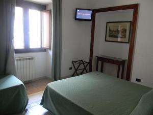 Postel nebo postele na pokoji v ubytování Hotel Primavera
