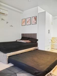 a bedroom with two beds in a room at LunaVista in Bankal +15 photos