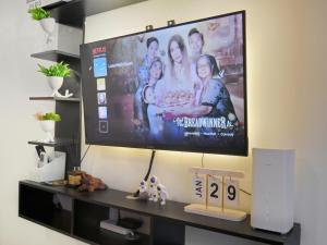 a flat screen tv hanging on a wall at LunaVista in Bankal
