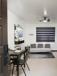 a living room with a couch and a table at LunaVista in Bankal