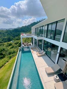 an image of a house with a swimming pool at Mountain Top Villa in Bophut