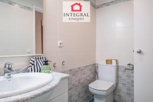 a bathroom with a sink and a toilet at Why Not Apartment Palamós in Palamós