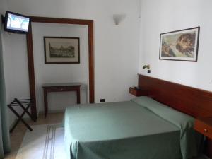Postel nebo postele na pokoji v ubytování Hotel Primavera