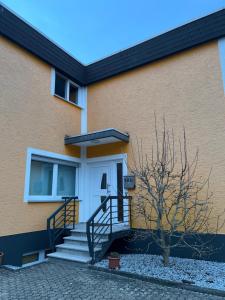 a building with a staircase leading to a door at Ferienwohnung Fatlume No 5 n 6 in Bad Honnef am Rhein