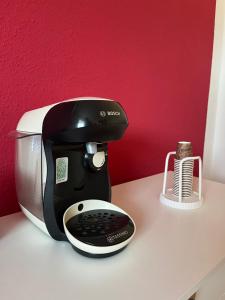 a coffee maker sitting on top of a table at Ferienwohnung Fatlume No 5 n 6 in Bad Honnef am Rhein +28 photos