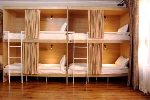 a hostel with bunk beds in a room at Bozui Hostel Osh in Osh